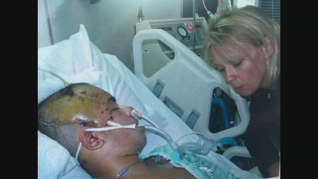 Zack Hornback, left, and his mother, Eileen Hornback, in the hospital